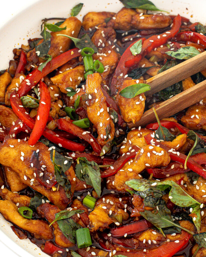 basil stir fry with chicken in pan