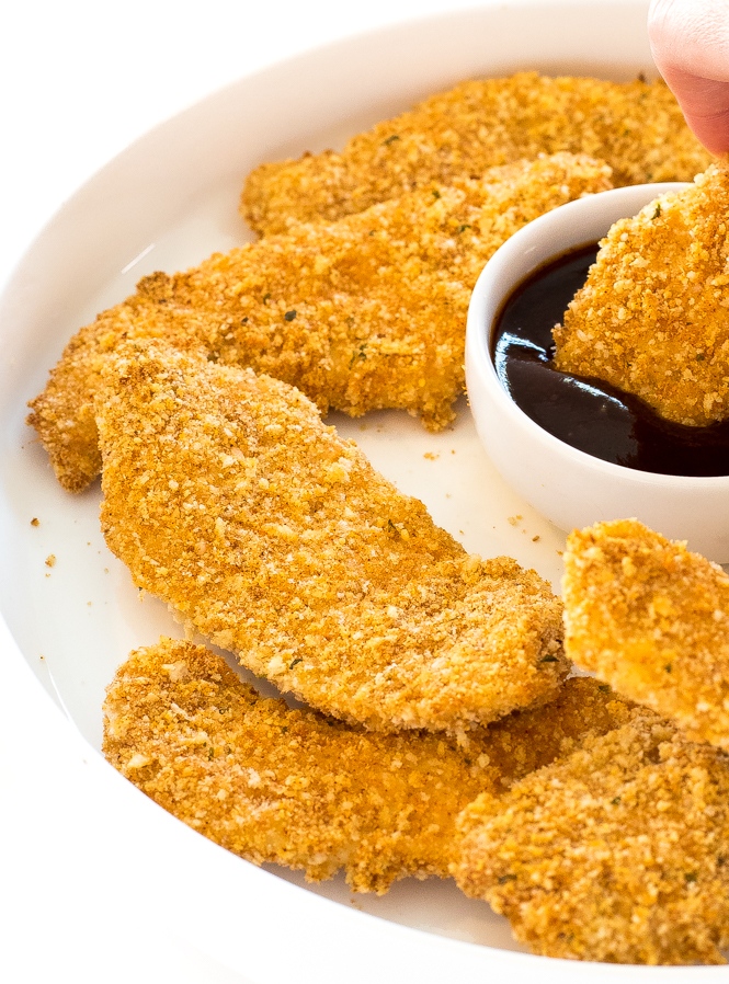 Chicken tenders on white serving plate