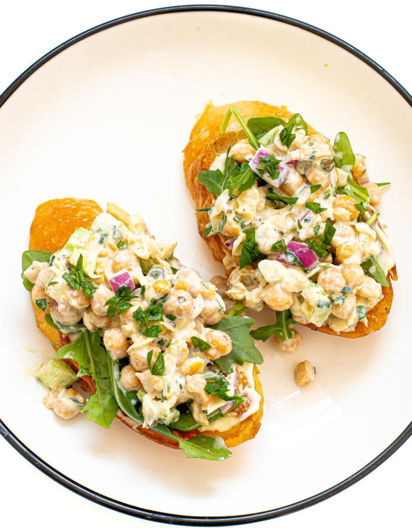 Chickpea salad on two pieces of toast.