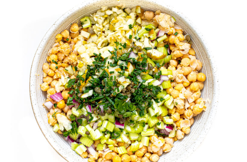 Chickpea salad ingredients in a bowl.