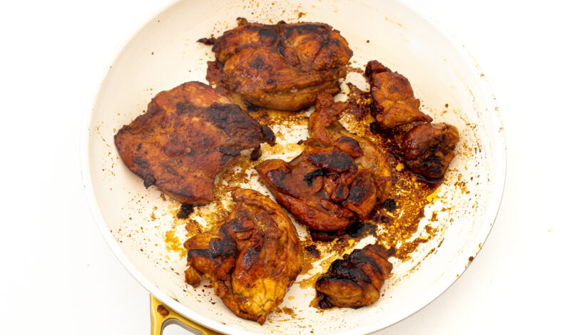 Honey chipotle chicken cooking in a pan. 