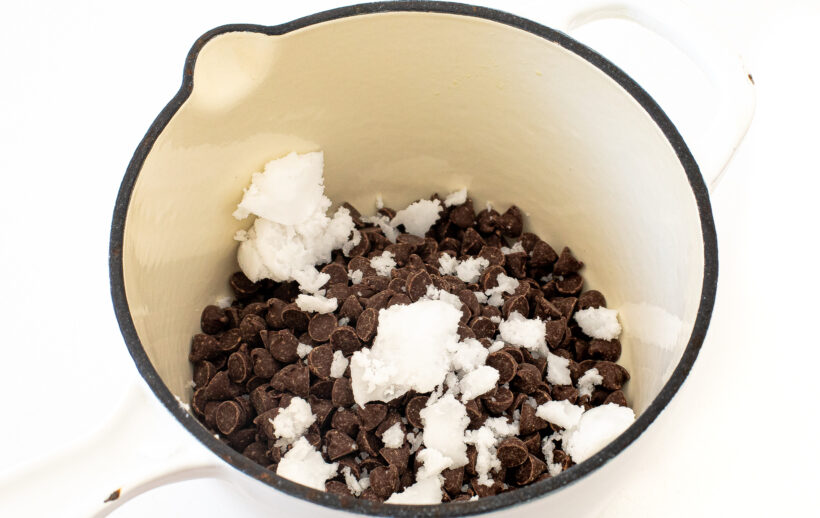 Chocolate chips and coconut oil in a saucepan.