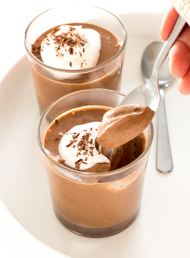 This 3-ingredient homemade chocolate mousse in two glasses topped with whipped cream and chocolate shavings | chefsavvy.com