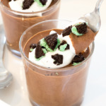 Mint Chocolate Mousse in glass cups with peppermint whipped cream and chopped mint oreos | chefsavvy.com