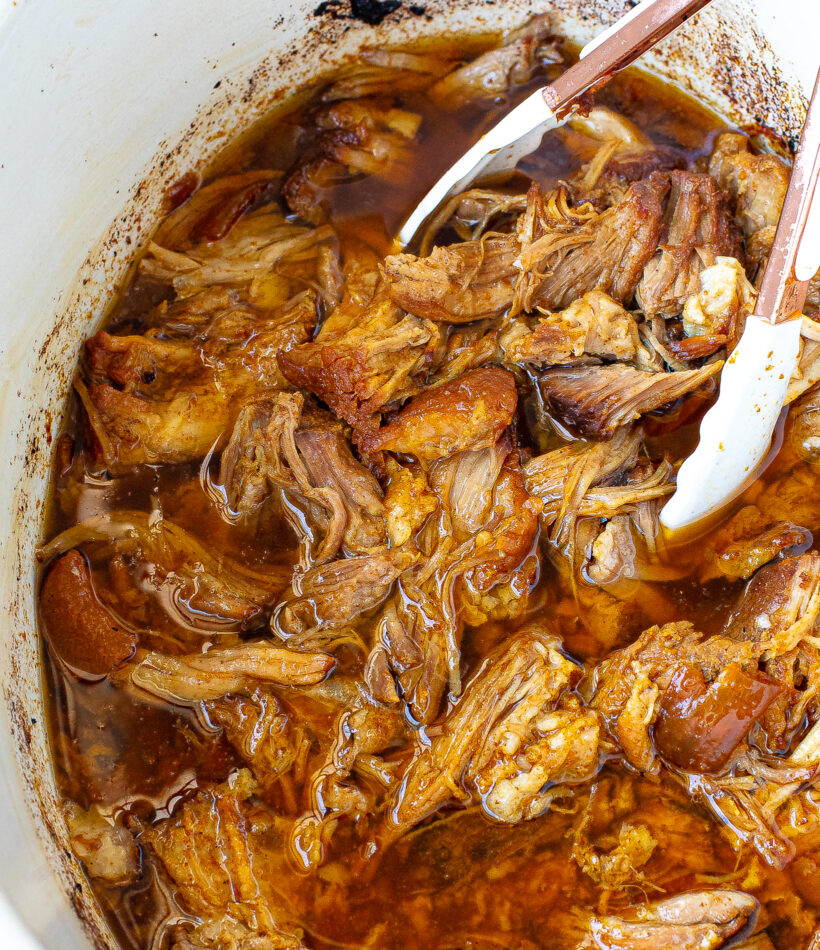 shredded pork shoulder in crockpot with juices