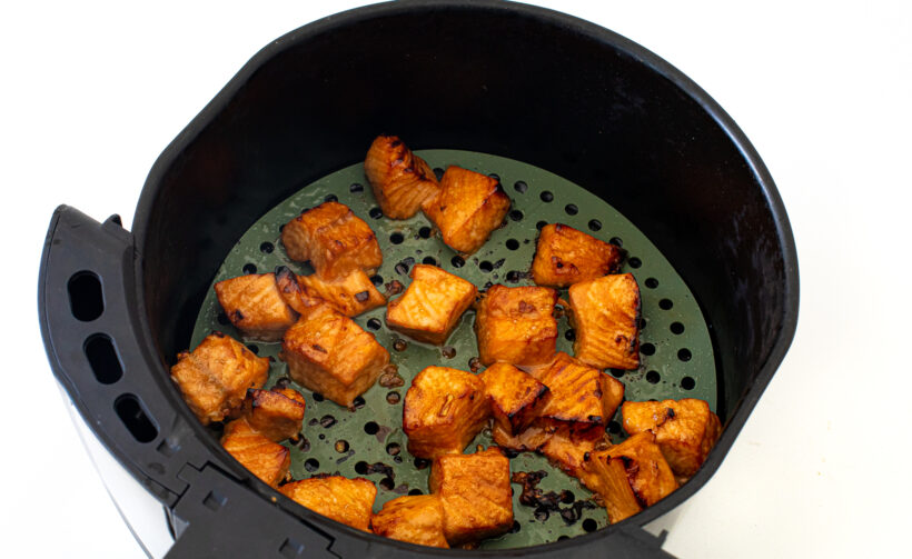 Salmon bites in the air fryer after being cooked. 