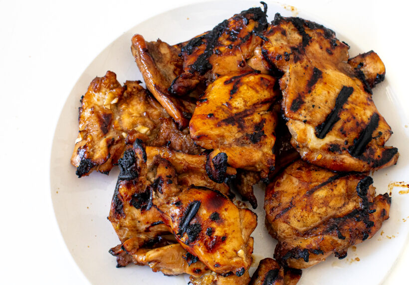 Grilled honey lime chicken breasts on a plate.