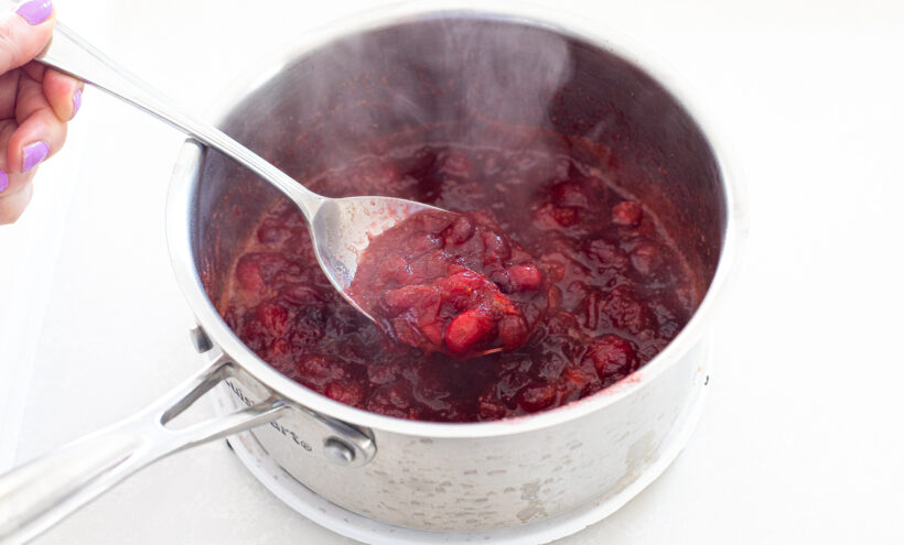 simmering fresh cranberries and water in a small saucepan