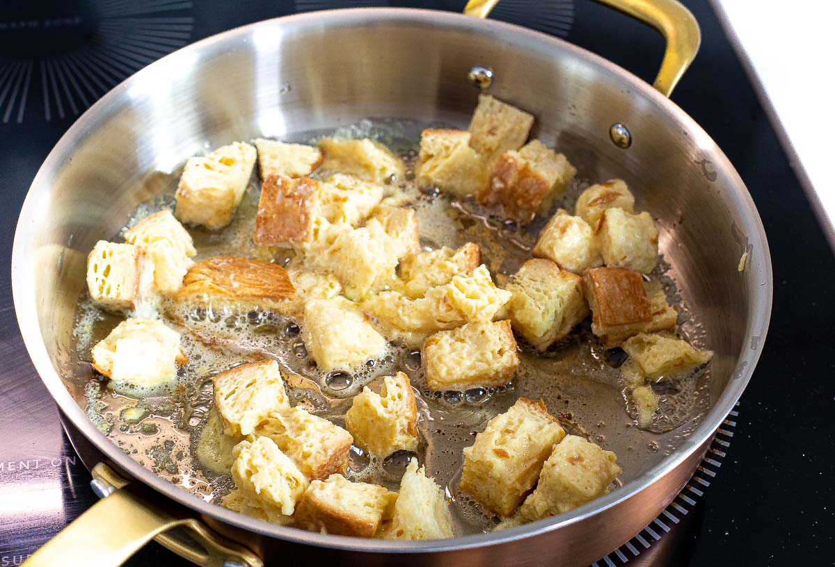 pan frying French toast bites in butter in large pan