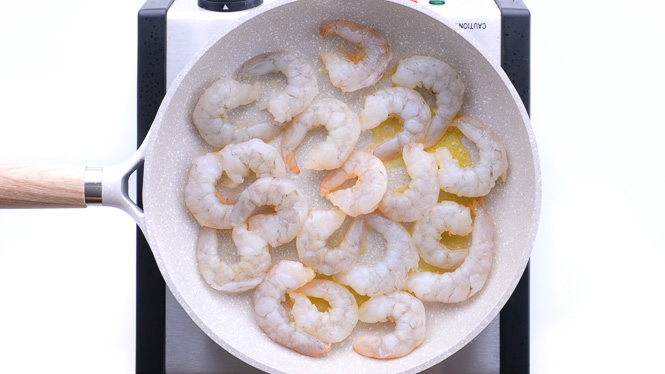 cooking shrimp in large skillet.