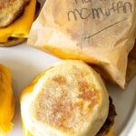 homemade English muffins topped with breakfast sausage egg and melted cheese