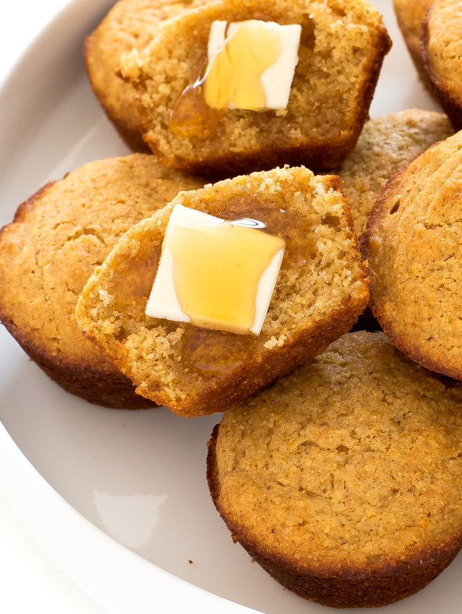 corn muffin with butter and honey on half of it