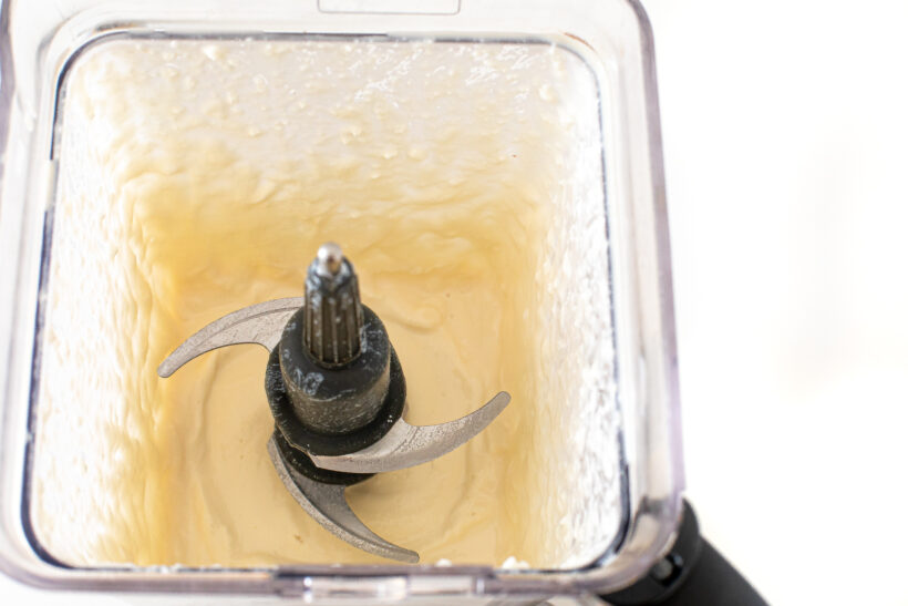 Cottage cheese and chicken broth blended together in a blender.