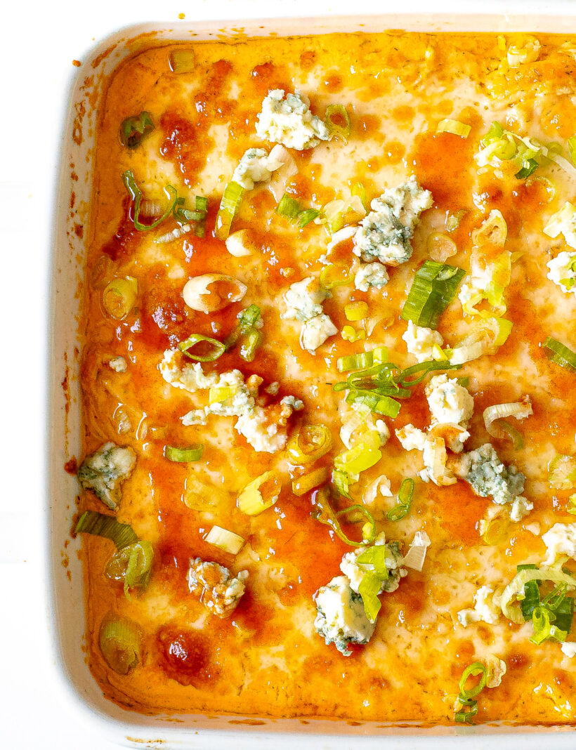 Cottage cheese buffalo chicken dip in a white baking dish.