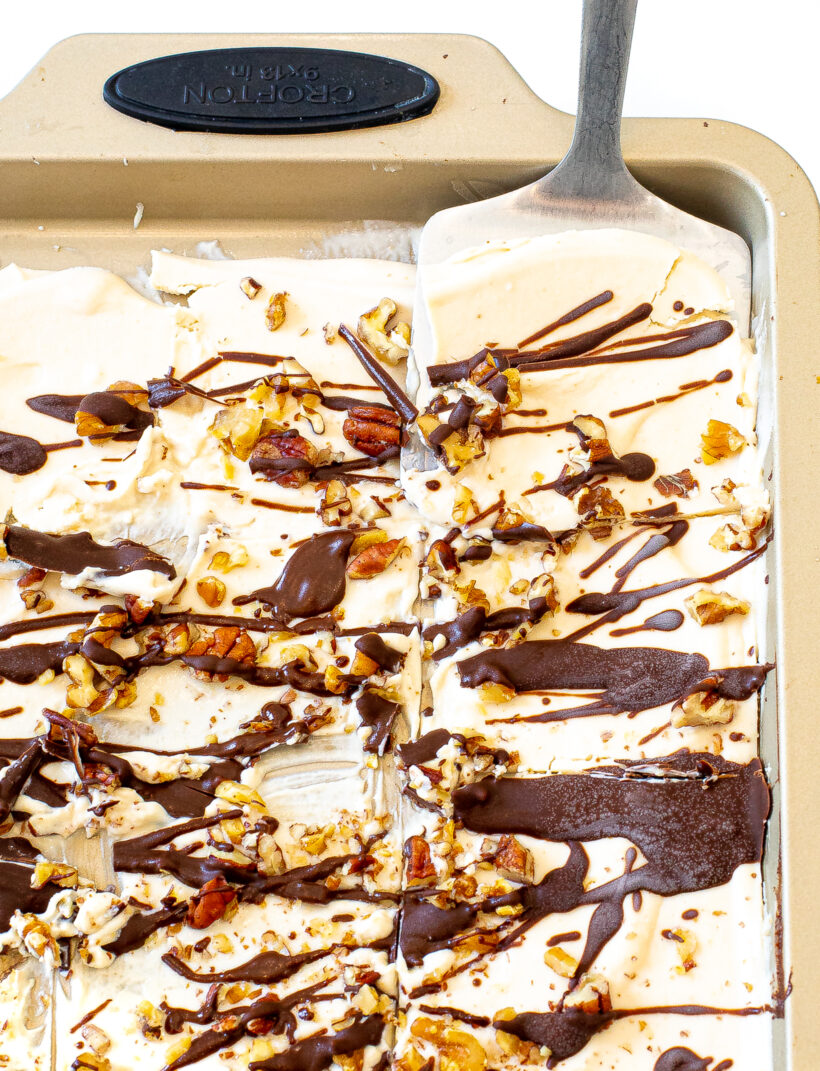 Cutting the bark into squares with a spatula picking up one square.