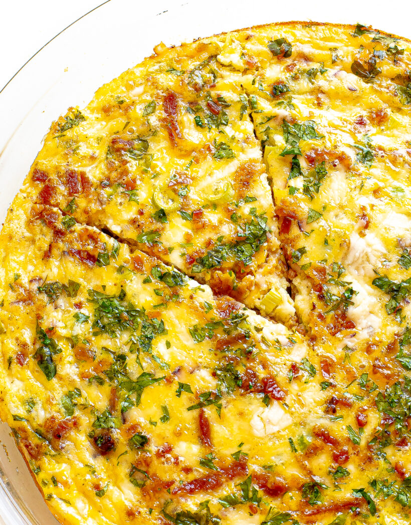 Cottage cheese quiche with a slice cut into it.