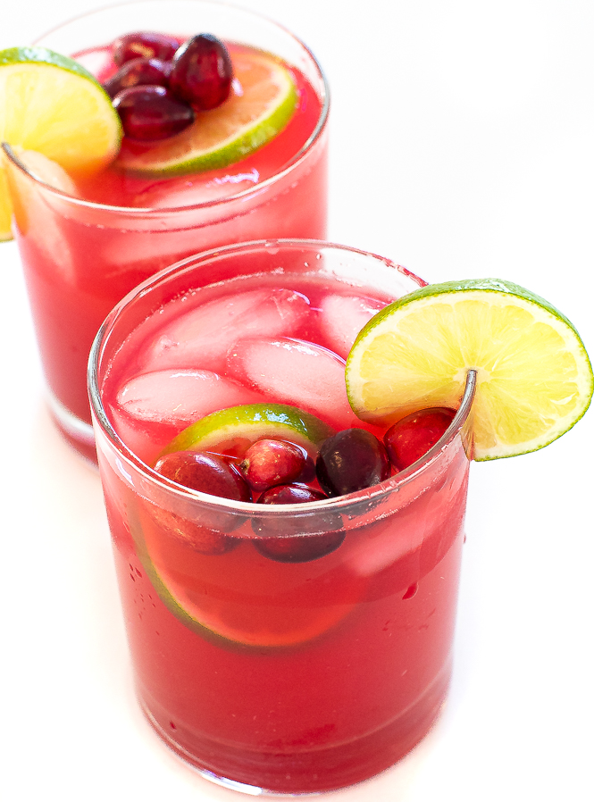 holiday Christmas margaritas with cranberries and lime slices