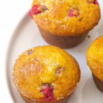 Cranberry Orange Muffins on a white plate.