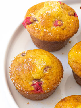 Cranberry Orange Muffins on a white plate.