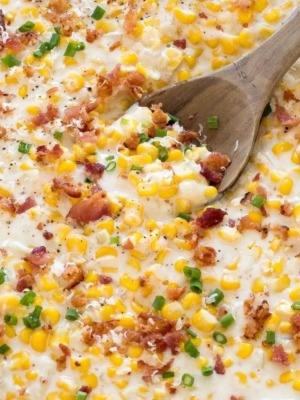 creamed corn with wooden spoon