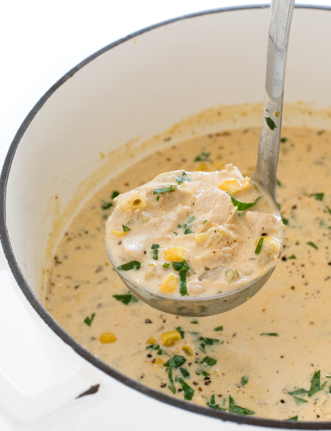 using a ladle to scoop out white chicken chili