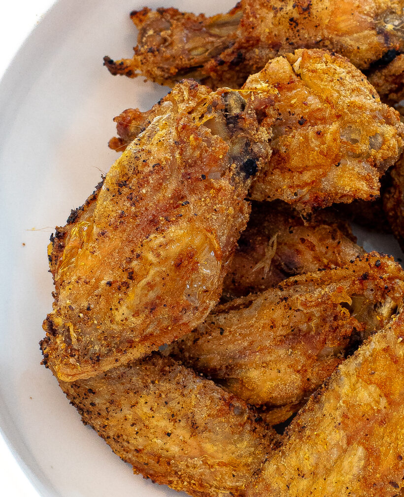 naked unsauced baked chicken wings in a bowl