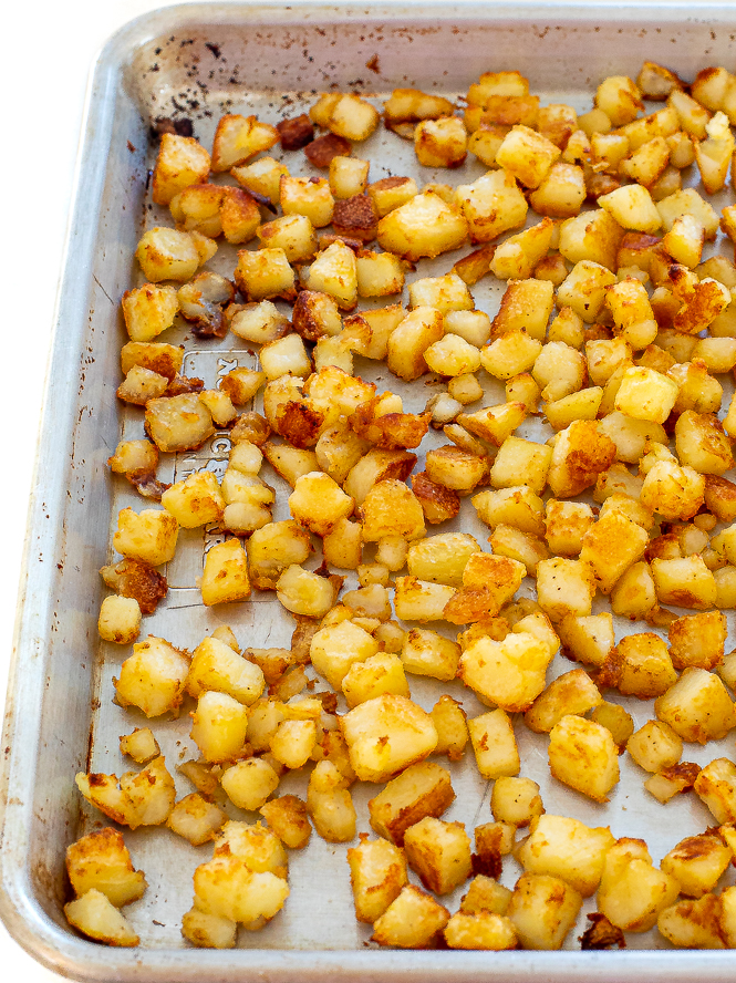 Potatoes on a baking sheet after being baked.