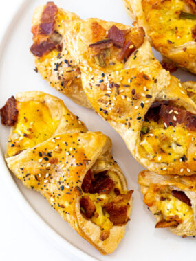 Bacon, Egg and Cheese Pastries on a white plate.