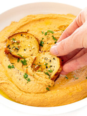 cropped-dipping-chips-into-hummus.jpg