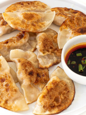 cropped-pan-fried-dumplings-on-white-pan.jpg