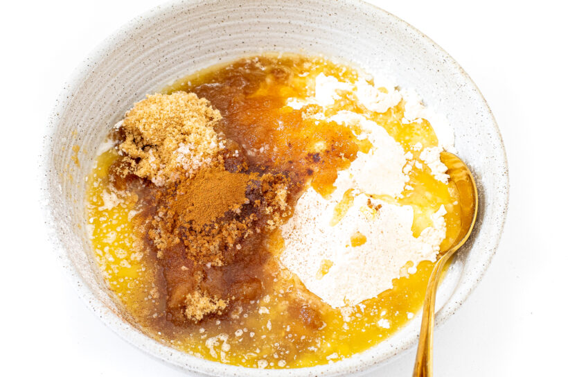 A mixing bowl with ingredients for the crumb layer.