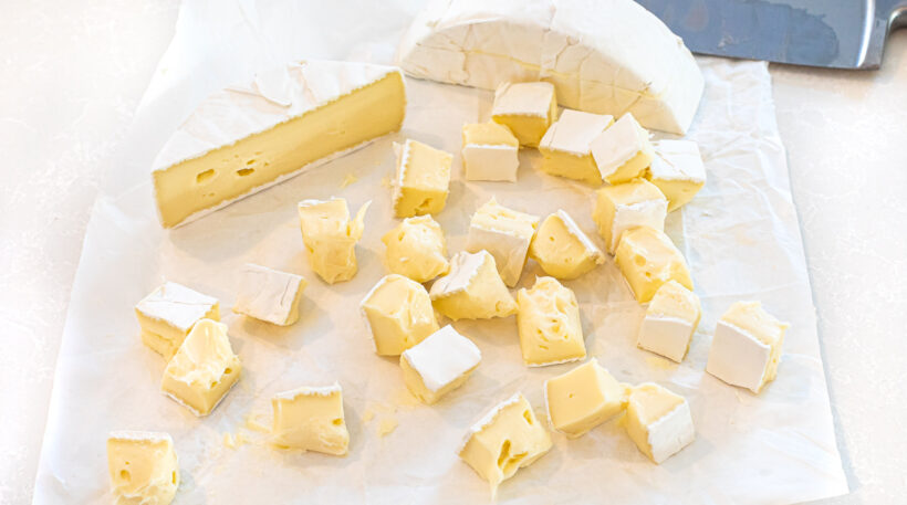 cubed brie cheese on white counter