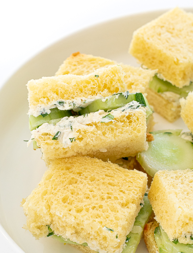 Cucumber tea sandwiches on plate.