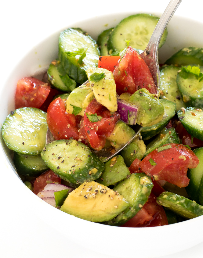 avocado cucumber salad sprinkled with salt and pepper