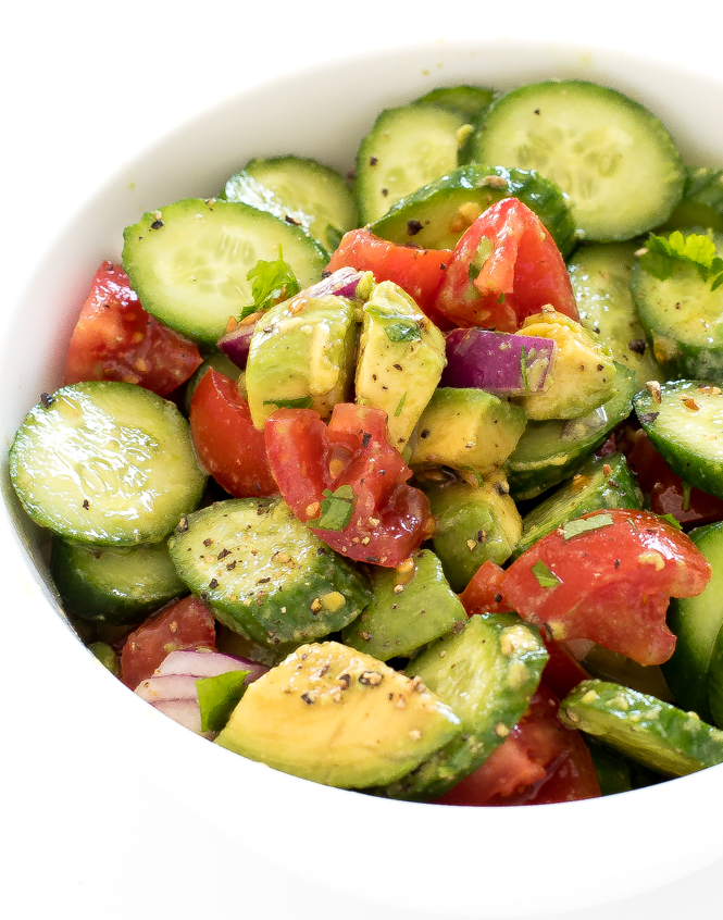 cucumber avocado salad tossed together in large bowl