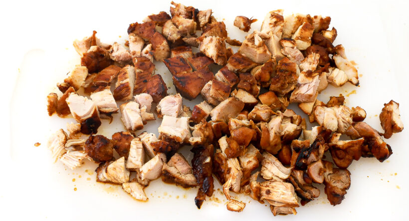Diced chicken on a cutting board. 