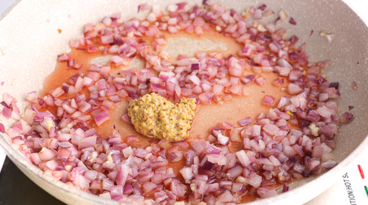 adding dijon mustard to skillet