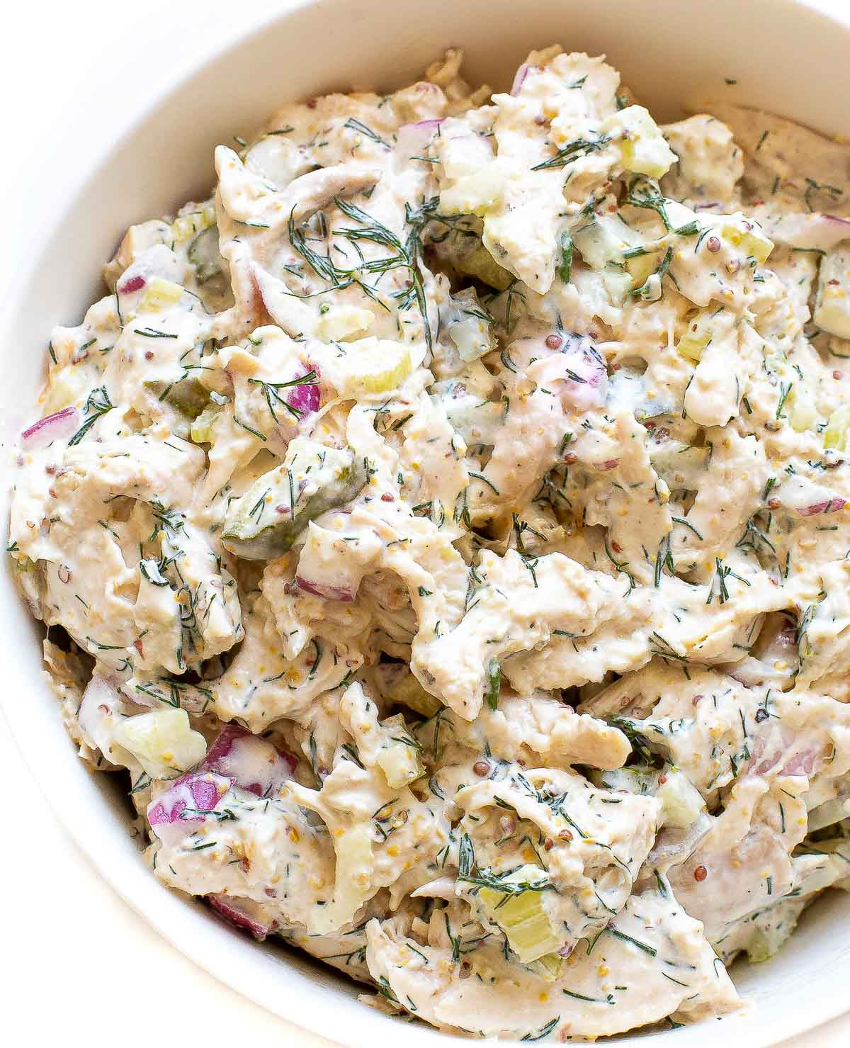 dill pickle chicken salad in a white bowl