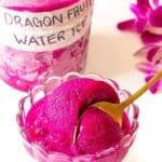 Dragon fruit water ice with a spoon in it.