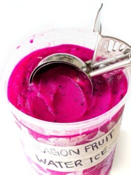 Dragon fruit water ice in a plastic container.