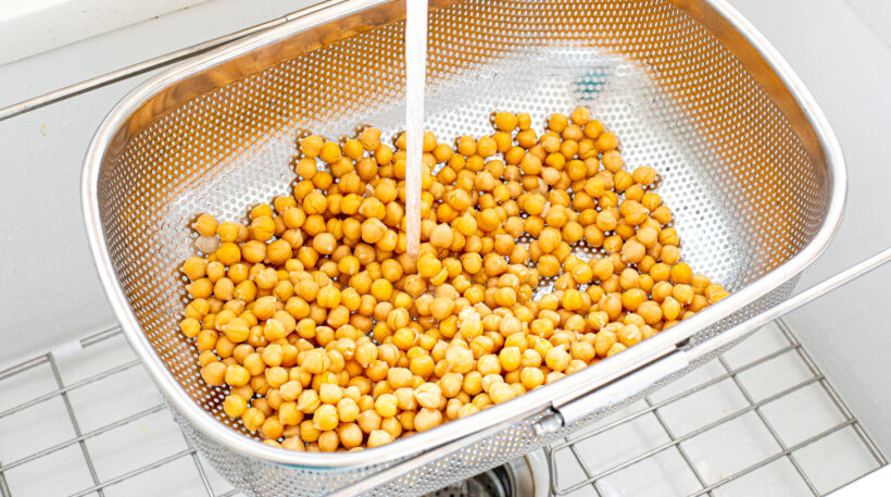 Chickpeas rinsed and drained in a colander.