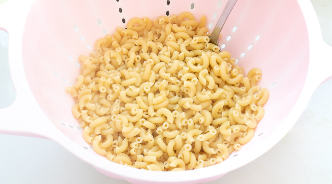 Boiled pasta in a colander.