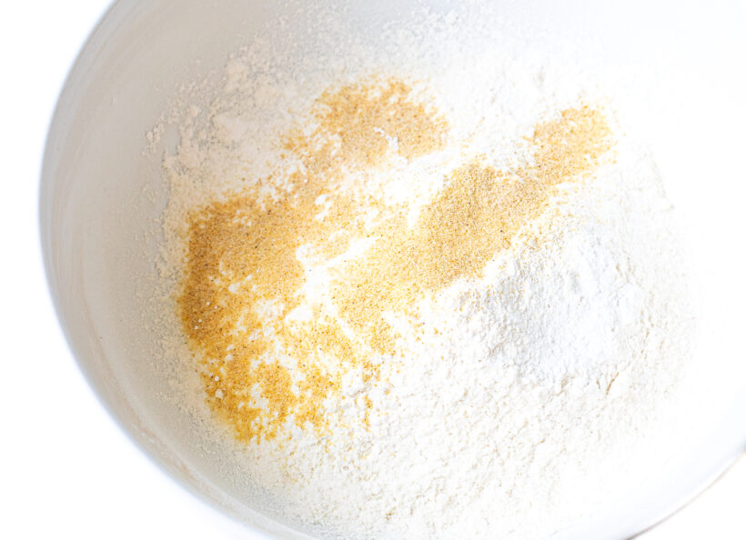 Dry ingredients in a white mixing bowl.