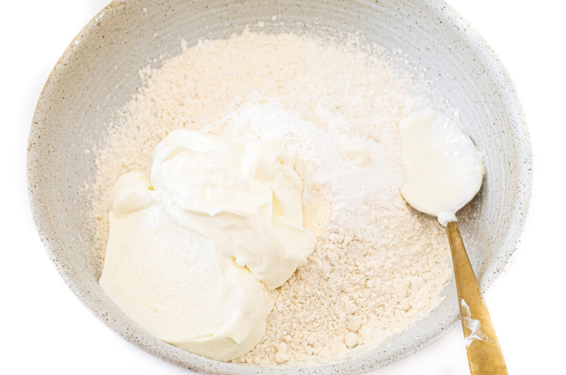 Naan bread ingredients in a mixing bowl.