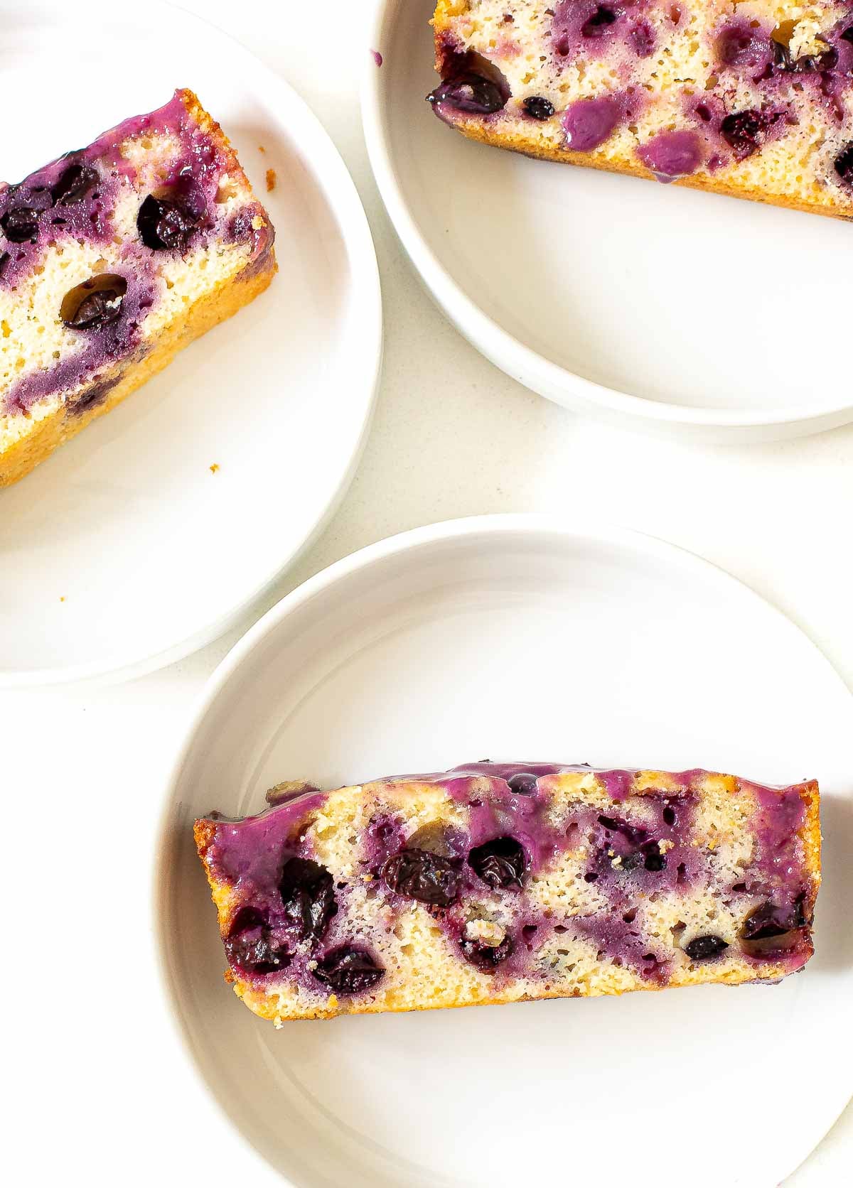lemon blueberry bread with a homemade blueberry glaze on top