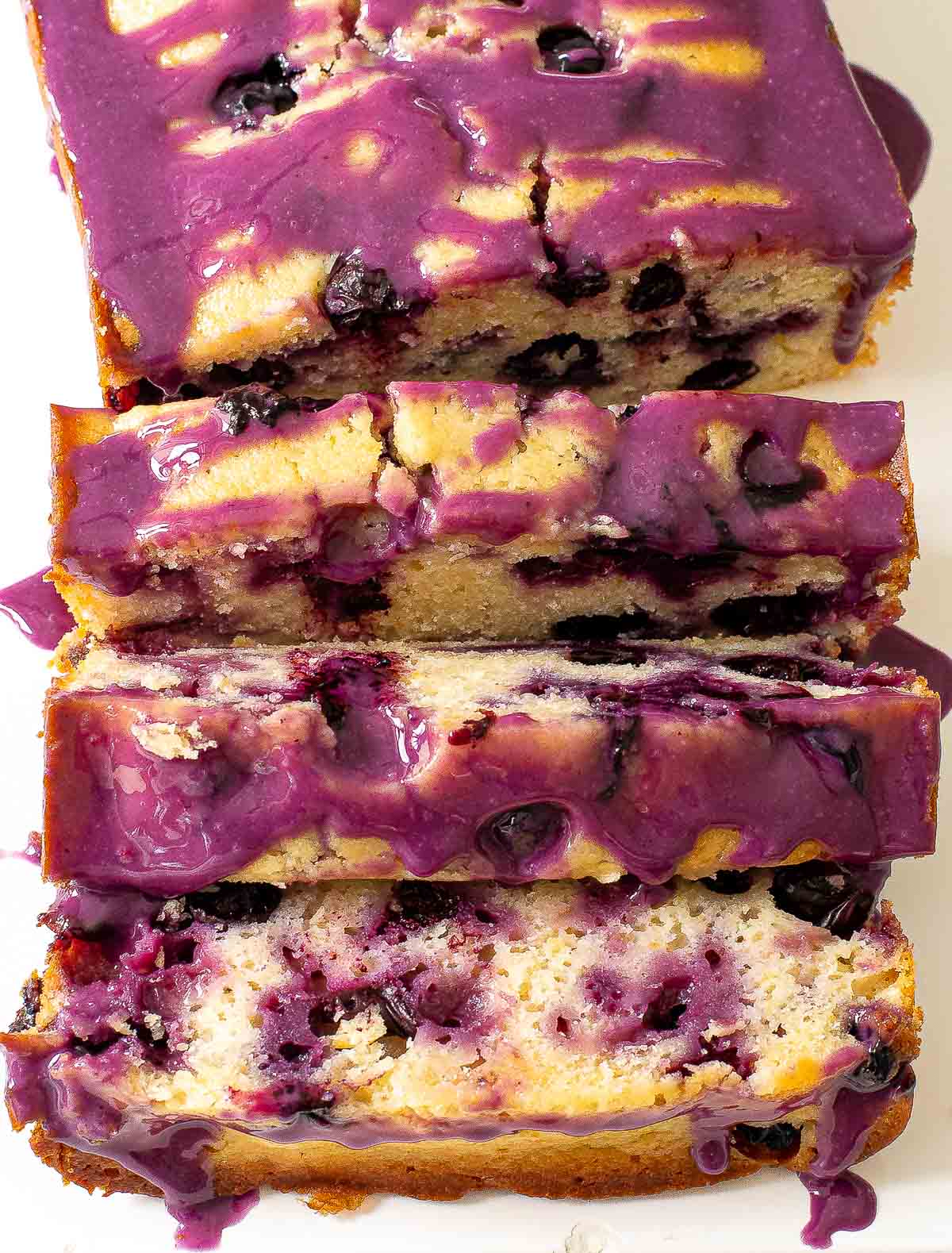 lemon loaf with homemade blueberry glaze on top 