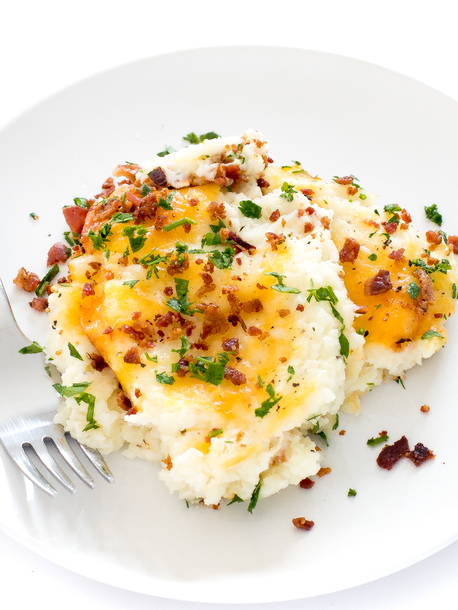 Mashed Potato Casserole on a white plate with fork