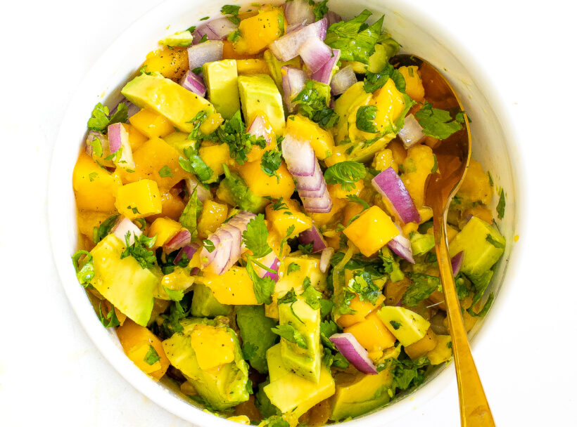 Mango avocado salsa in a bowl after being mixed.