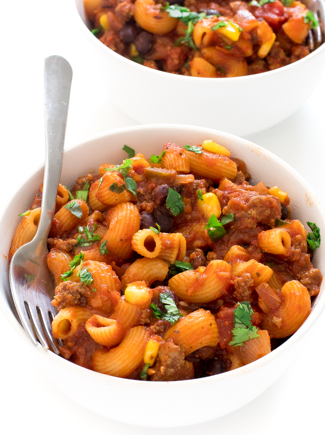 Mexican style pasta in a white bowl topped with fresh chopped cilantro