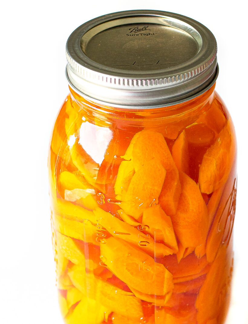 pickled carrots in mason jar with pickling liquid